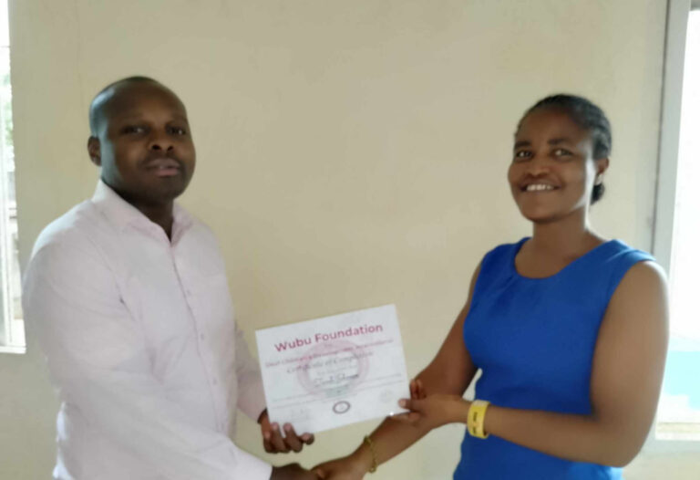 Taweh Johnson receiving Wubu Foundation certificate